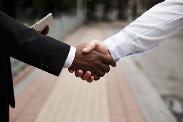 African american male shaking hands with european man