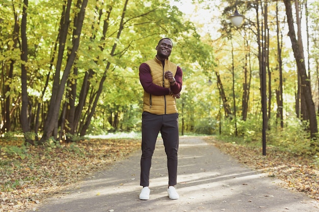 African american male student walking in the park