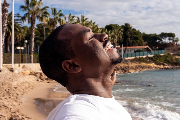 African American man breathing air near sea