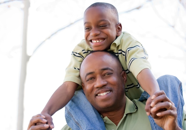 African American Man and Child Having Fun