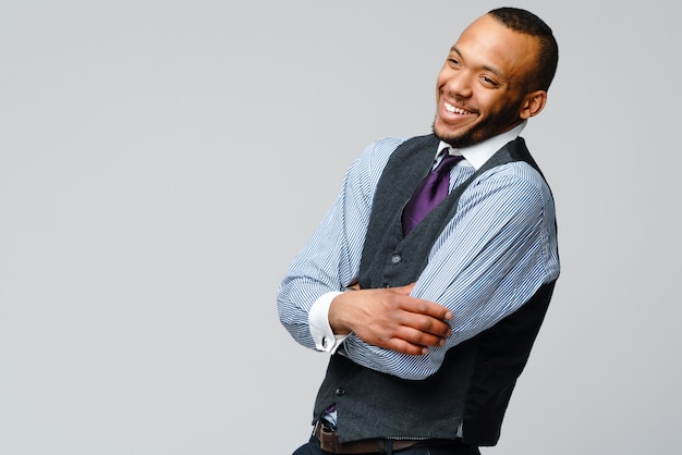 African-American man face portrait over grey wall.