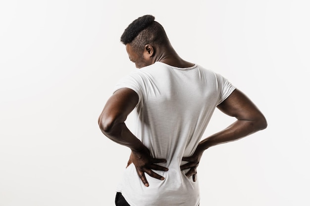 Photo african american man feel backache spine pain because of uti pyelonephritis disease on white background kidney infection pyelonephritis urinary tract infection