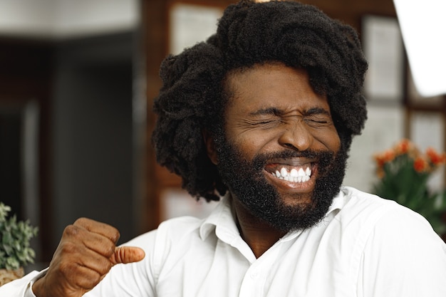 African american man smiling with closed eyes close up