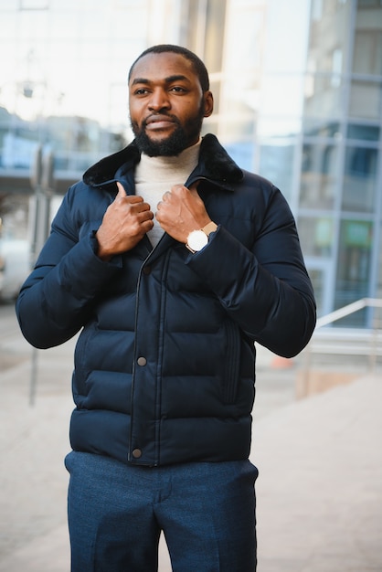 African American man in stylish new clothes on the street