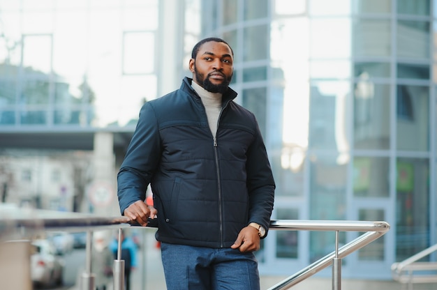 African American man in stylish new clothes on the street