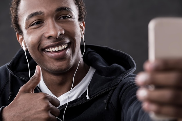 African American man taking selfie