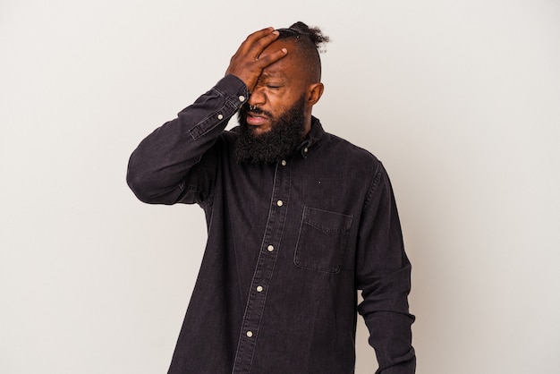 Photo african american man with beard isolated on pink background forgetting something, slapping forehead with palm and closing eyes.