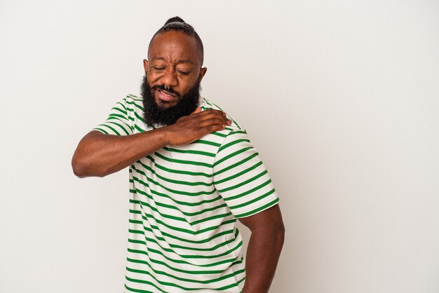 African american man with beard isolated on pink wall having a shoulder pain.