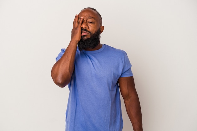 African american man with beard isolated on pink wall tired and very sleepy keeping hand on head.