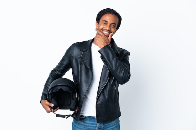 African American man with braids holding a motorcycle helmet isolated on white background happy and smiling