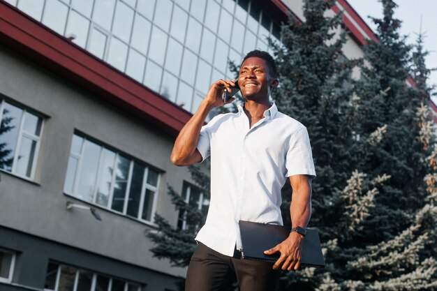 African-american man with a phone on the street