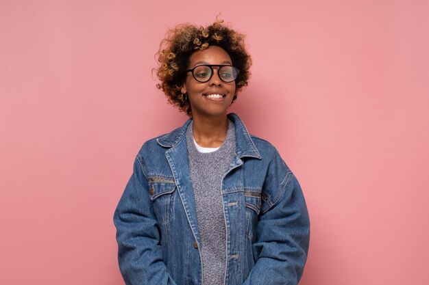 African american millennial woman in glasses looking at camera