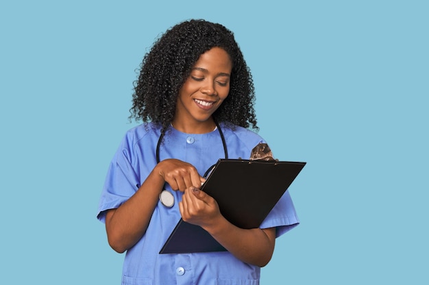 African American nurse with patient report