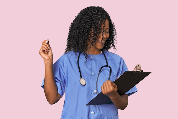 African American nurse with patient report