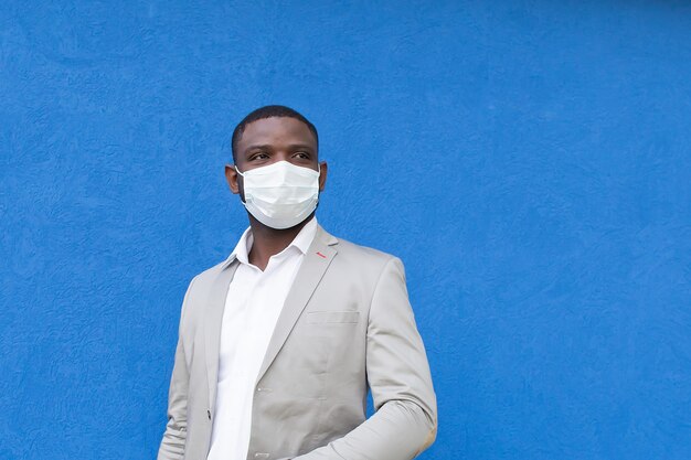  African American in a protective mask on a blue background