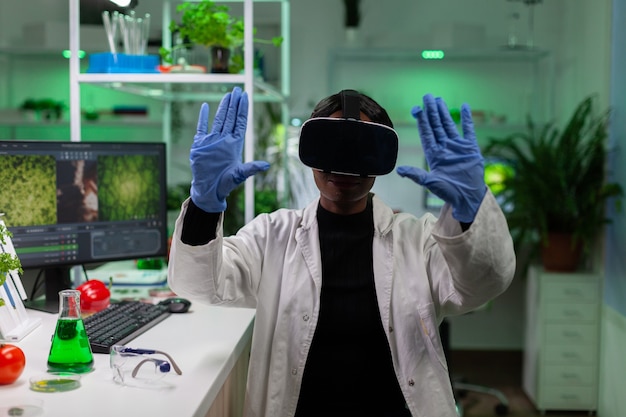 African american scientist woman wearing virtual reality headphones