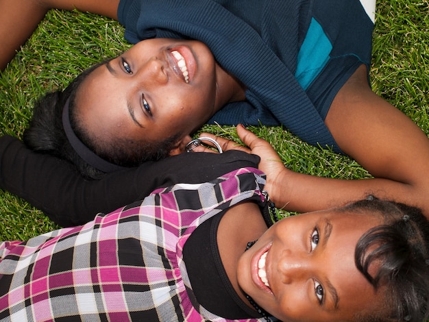 African American sisters in the park.