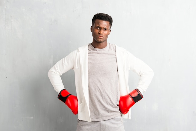 African american  sportman with boxing gloves