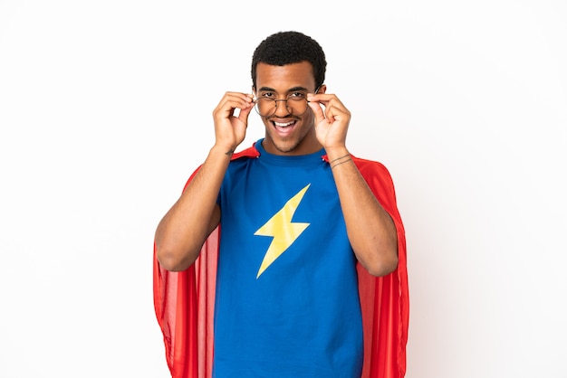 African American Super Hero man over isolated white background with glasses and surprised