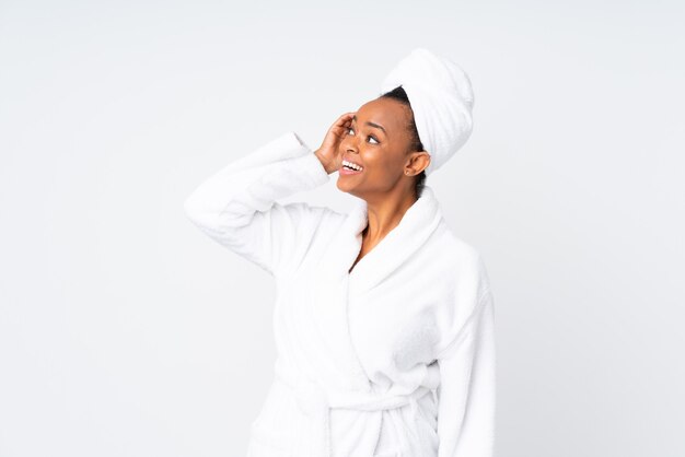 African american woman  in a bathrobe laughing