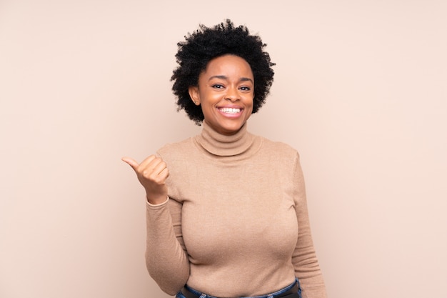 African American woman over beige wall