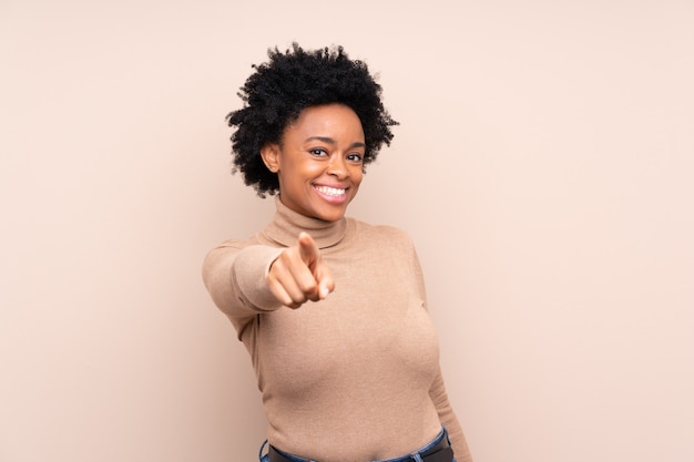 African American woman over beige wall