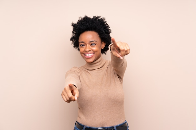 African American woman over beige wall