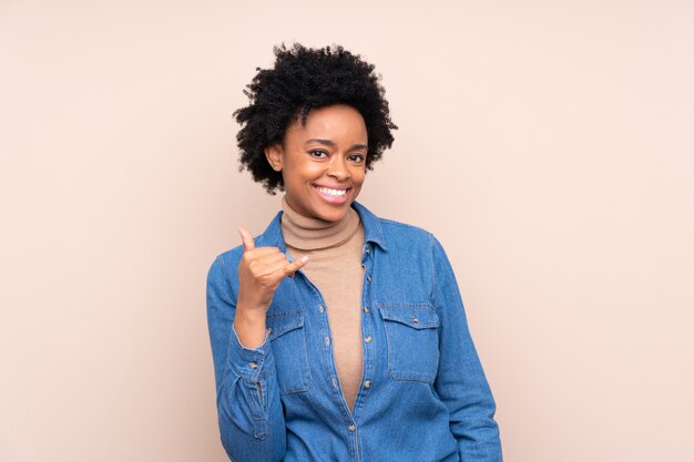 African American woman over beige wall