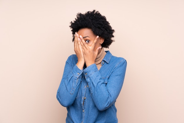 African American woman over beige wall