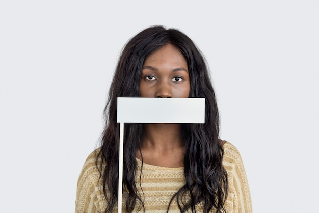 African American woman covering her mouth