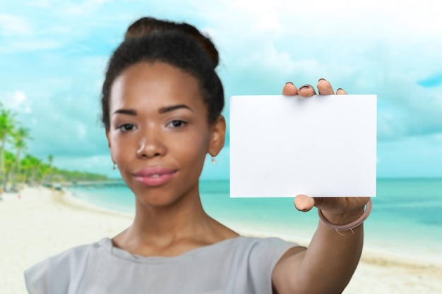 African american woman holding blank paper