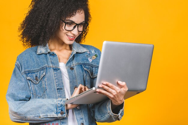 African american woman holding laptop