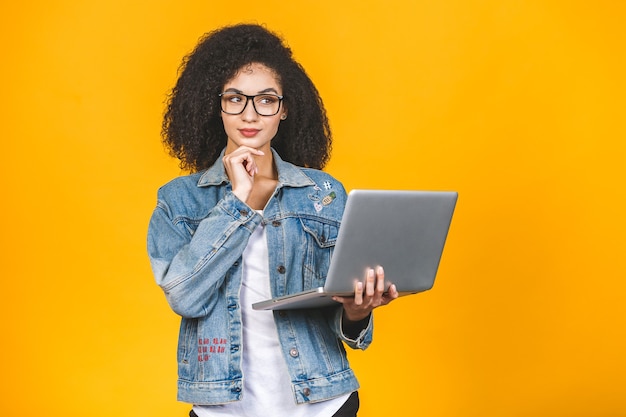 African American woman holding laptop