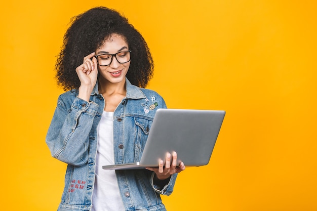 African American woman holding laptop