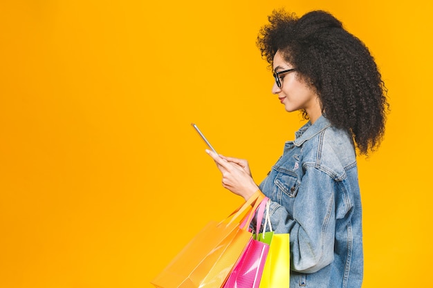 African American woman holding shopping bags