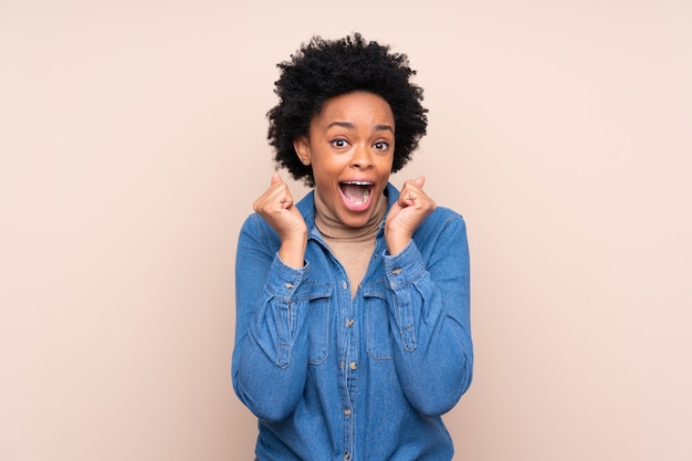 African american woman isolated celebrating a victory