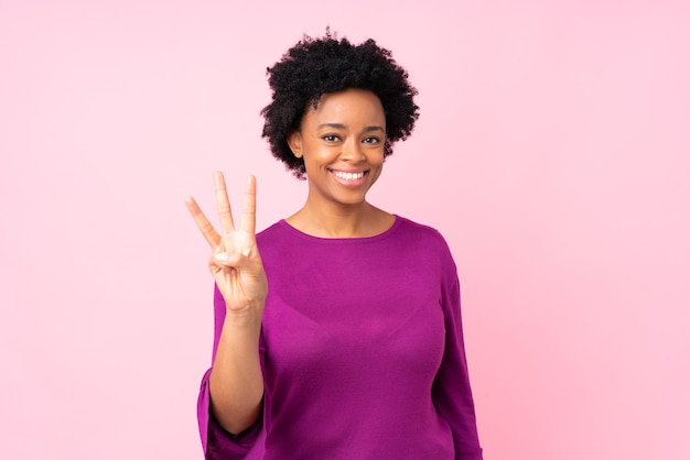 African american woman isolated happy and counting three with fingers