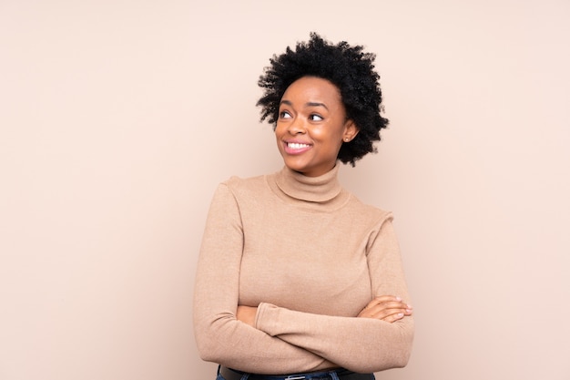 African american woman over isolated looking up while smiling