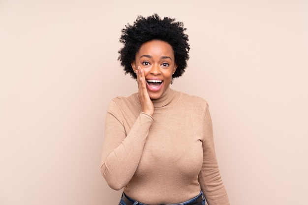 African american woman isolated with surprise and shocked facial expression