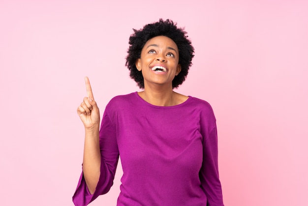 African American woman over pink wall