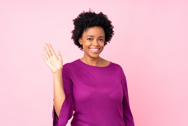 African American woman over pink wall