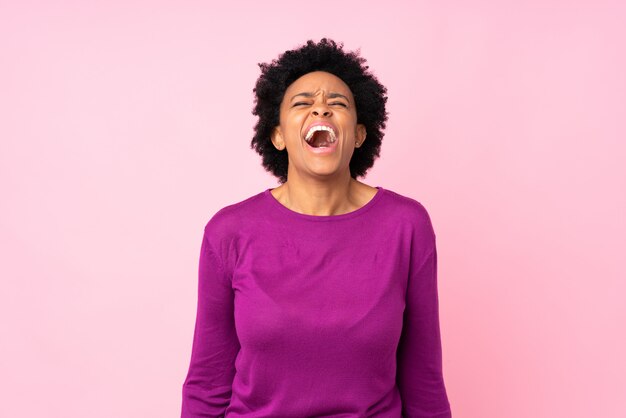 African American woman over pink wall