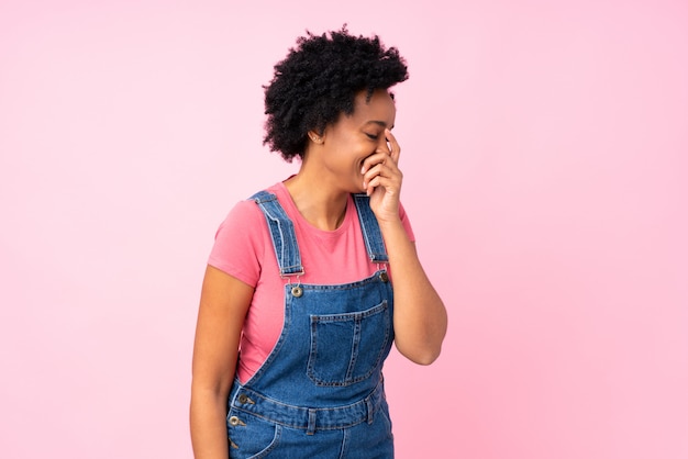 African American woman over pink wall