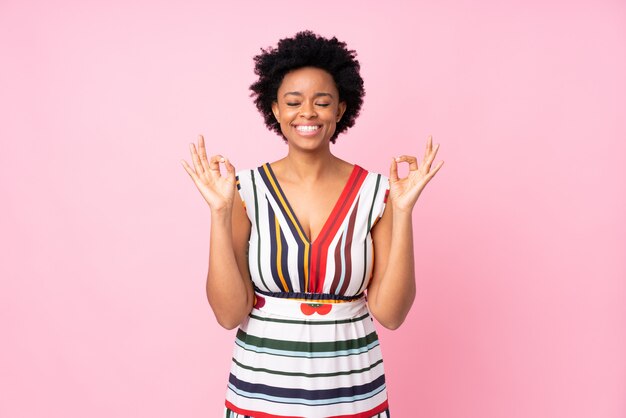 African American woman over pink wall