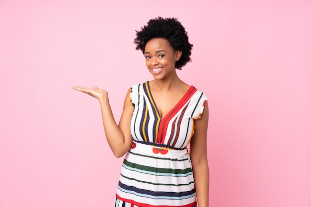 African American woman over pink wall