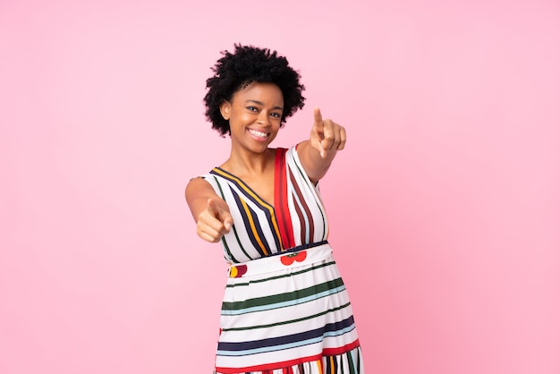 African American woman over pink wall