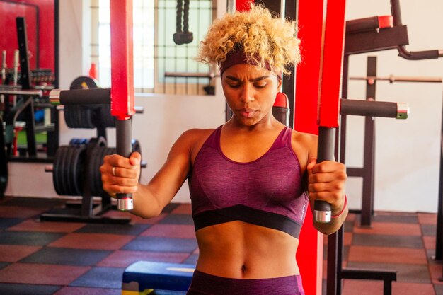 African american woman pullup athletic iron indoors