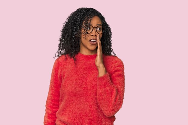 African American woman in studio setting being shocked because of something she has seen