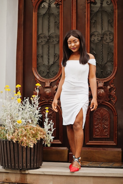 African American woman in a white dress