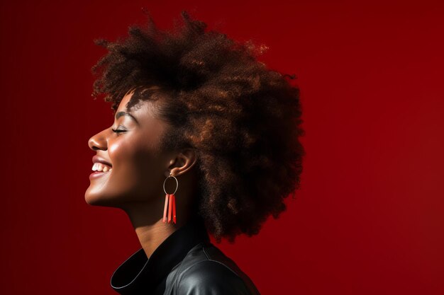 an african american woman with afro hair smiling and looking up